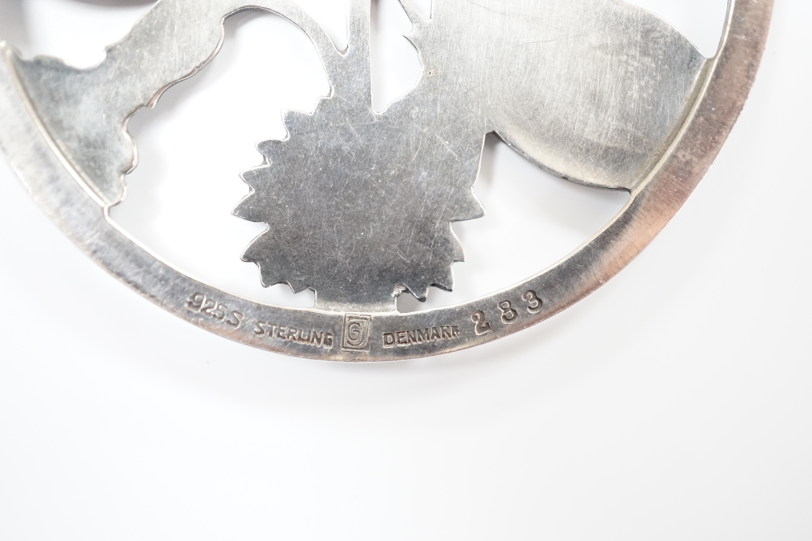 A George Jensen sterling ' butterflies amid foliage' circular brooch, design no. 283, 52mm.
